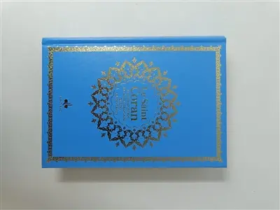 Le saint Coran : et la traduction en langue française du sens de ses versets : couverture bleu ciel