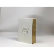 Le saint Coran : et la traduction en langue française du sens de ses versets, et la transcription en caractères latins, en phonétique : couverture cuir cartonné blanc, doré sur tranche