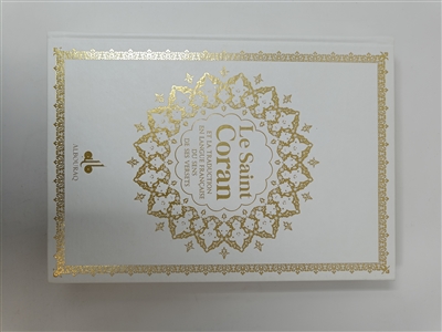 Le saint Coran : et la traduction en langue française du sens de ses versets : couverture tissu blanc