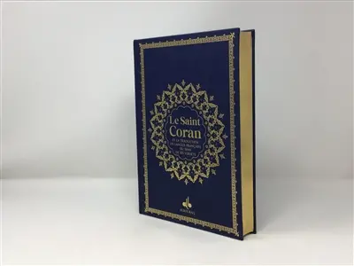 Le saint Coran : et la traduction en langue française du sens de ses versets, et la transcription en caractères latins, en phonétique : couverture cuir bleu nuit, doré sur tranche
