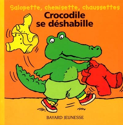 Crocodile se déshabille : salopette, chemisette, chaussettes